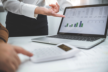 Reviewing financial figures on a laptop